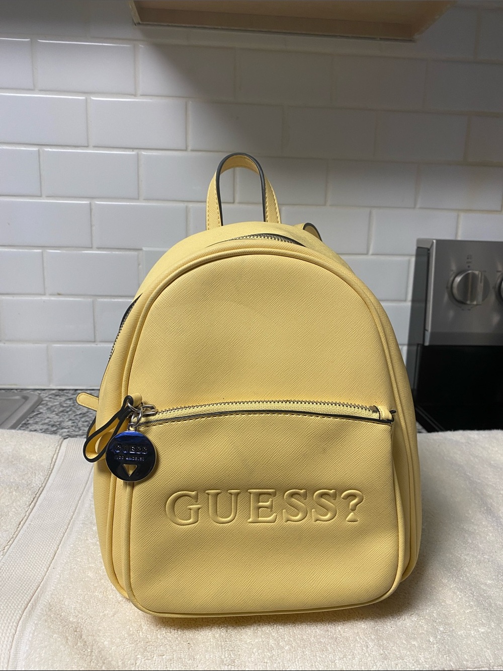 Guess Yellow Mini Backpack with Embossed Logo